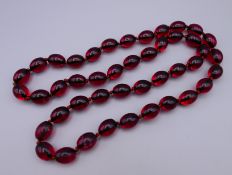 A string of beads. Approximately 84 cm long.