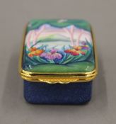 A boxed Moorcroft enamel Elysium box. 4 cm wide.