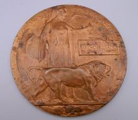 A WWI death plaque awarded to Arthur Cragg. 12 cm diameter.