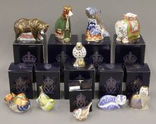 Ten boxed Royal Crown Derby paperweights.