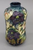 A Moorcroft Hellebore bottle vase. 20 cm high.