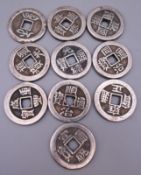 Ten Chinese coins. Each 3.25 cm diameter.