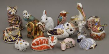 A collection of Royal Crown Derby paperweights.