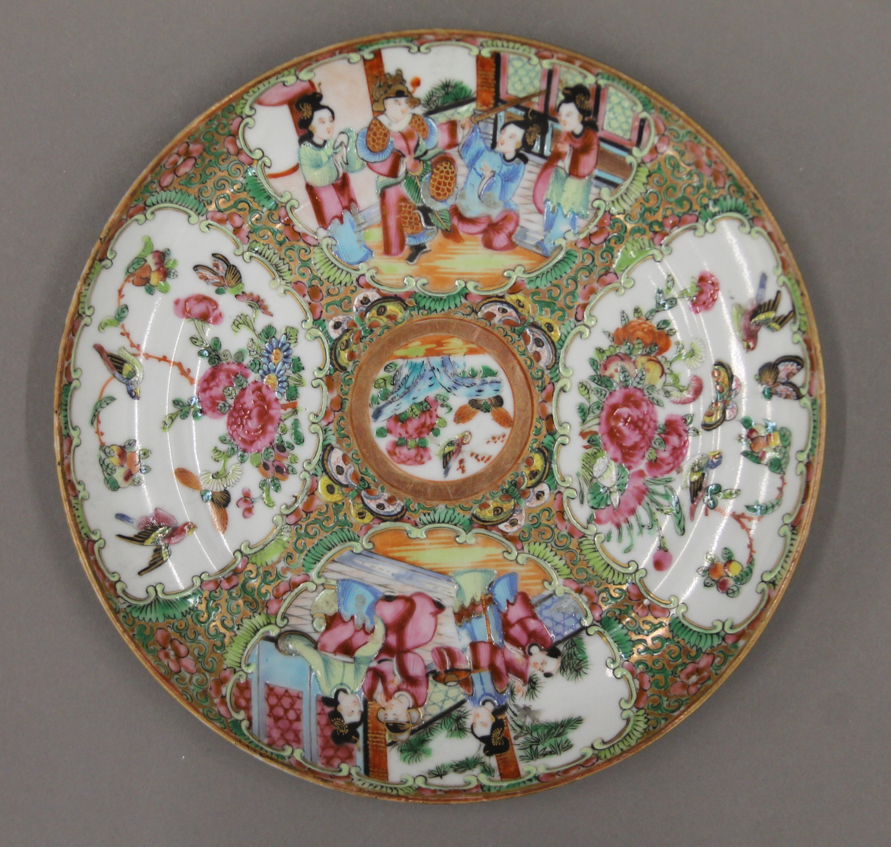 A 19th century Canton famille rose porcelain plate hand painted with attendants, birds, butterflies, - Image 2 of 6