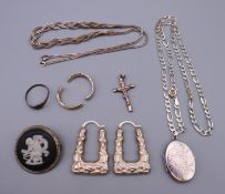 A quantity of silver jewellery to include a crucifix pendant, a necklace, a silver locket and chain,