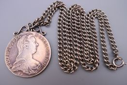 A silver 1 Thaler Maria Theresa Burg Co Tyr 1780 coin pendant on a sterling silver chain.