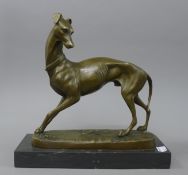 A bronze model of a greyhound. 25 cm high.