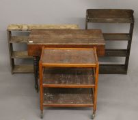 Two oak bookcases, an oak Pembroke table and a tea trolley.