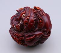 A netsuke decorated with various animals. 5 cm diameter.