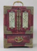 An Oriental wooden and jade cabinet. 25 cm high.