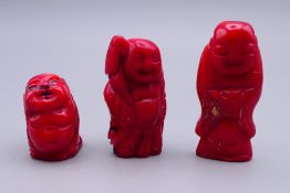 Three carved coral figures. Largest 4.5 cm high.