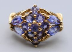 A 9 ct gold and tanzanite ring. Ring size O. 4.2 grammes total weight.