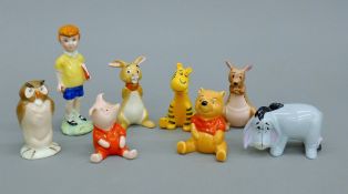 A collection of Eight Beswick Winnie the Pooh figurines.