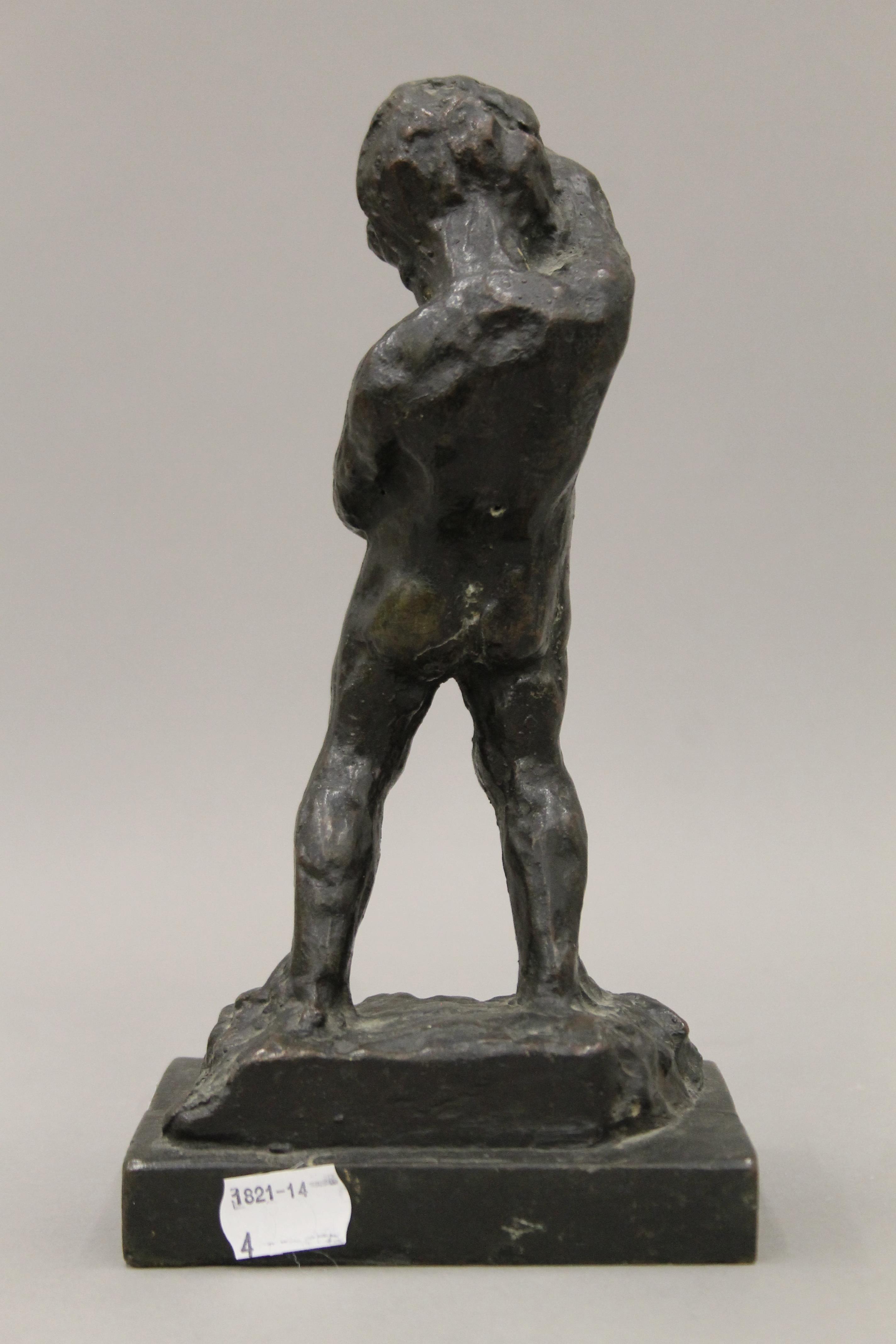 A patinated bronze model of a peeing boy. 23 cm high. - Image 3 of 3