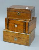 Three Victorian boxes, two walnut and one rosewood. The largest 30 cm wide.