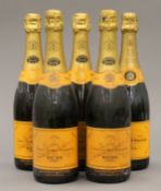 Five bottles of Veuve Clicquot Ponsardin Brut Champagne.