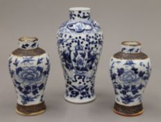 Three 19th century Chinese blue and white porcelain vases. The largest 18 cm high.