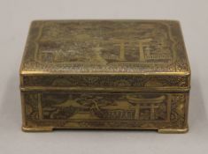 A Japanese brass box, the underside inscribed K 24 Gold Inlaid. 10 cm wide.