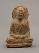 A carved stone model of Buddha;