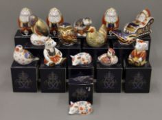 A collection of fifteen boxed Royal Crown Derby paperweights.