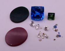 A quantity of gemstones, including diamonds, sapphires, etc.