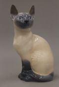 A Royal Copenhagen model of a Siamese cat. 19 cm high.