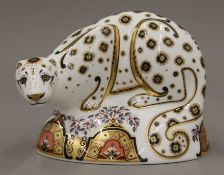 A Royal Crown Derby Snow Leopard paperweight. 16 cm long.