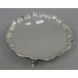 A silver salver. 30.5 cm diameter. 699 grammes.