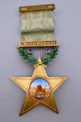An enamel decorated silver gilt Gwelo Lodge Masonic medal. 11.5 cm high.