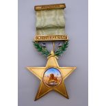 An enamel decorated silver gilt Gwelo Lodge Masonic medal. 11.5 cm high.