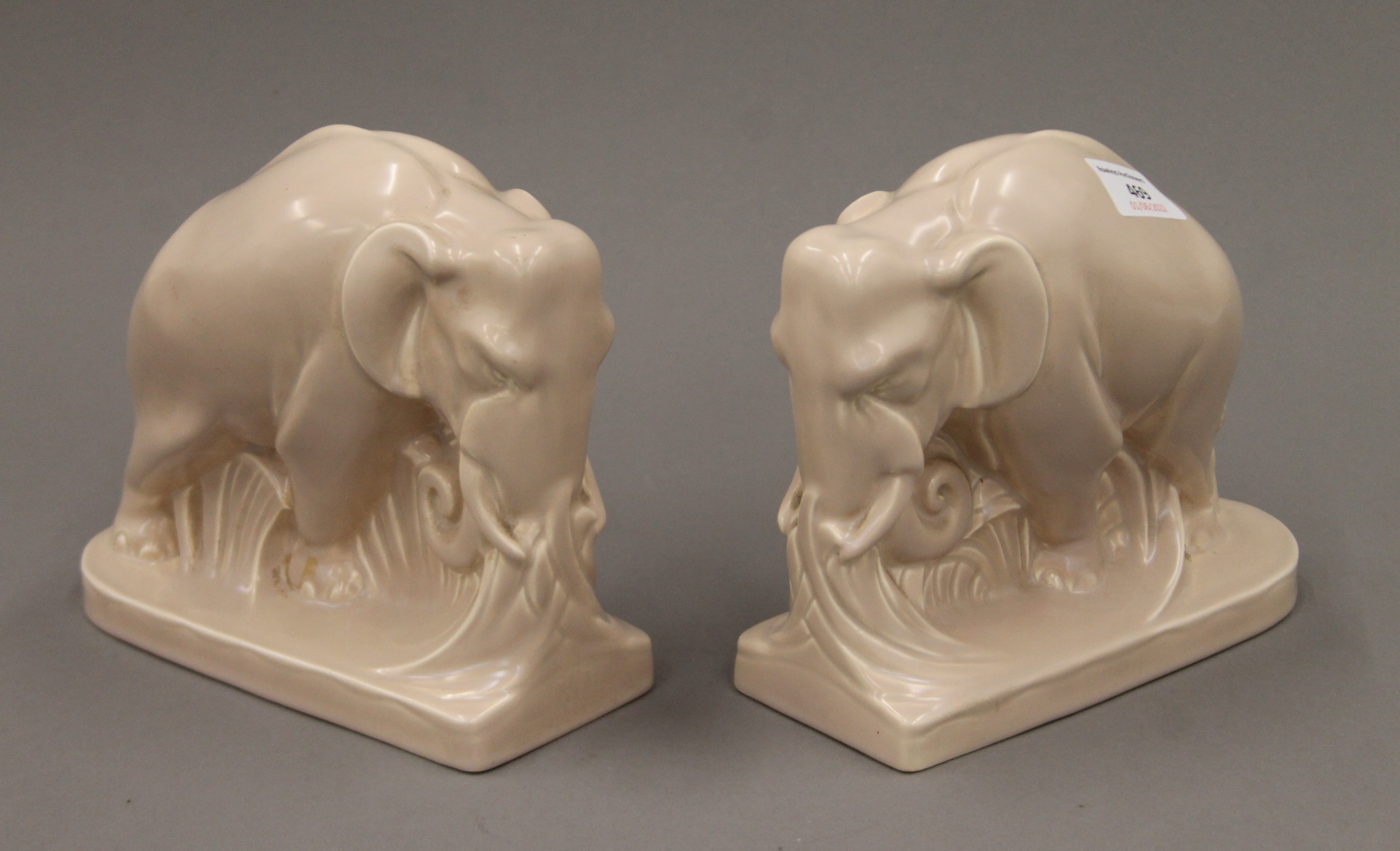 A pair of Poole pottery elephant form bookends. 18.5 cm long.