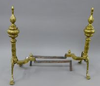 A pair of brass andirons.