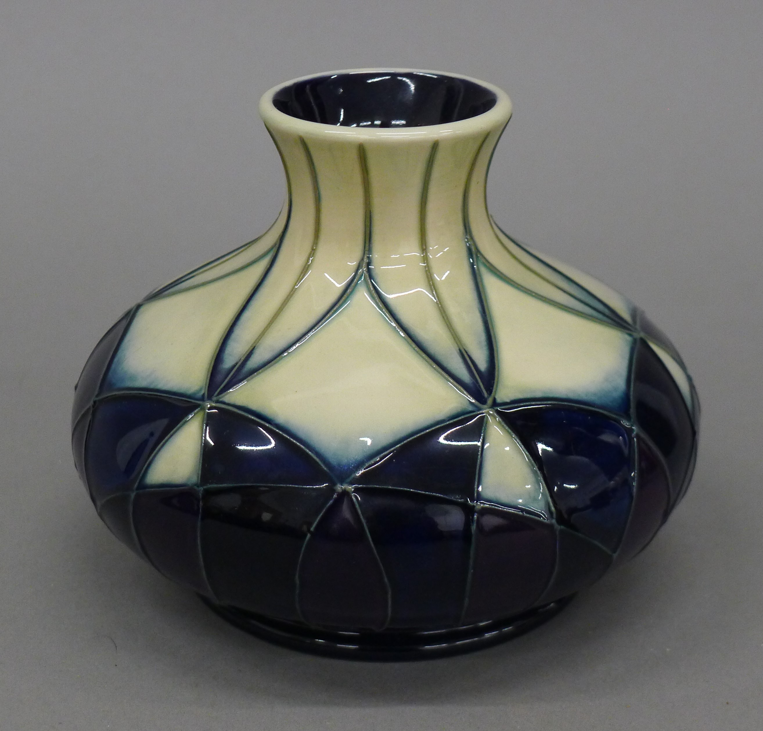 A Moorcroft Indigo vase. 9.5 cm high.