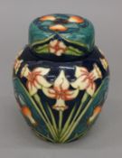 A Moorcroft Carousel ginger jar. 14.5 cm high.