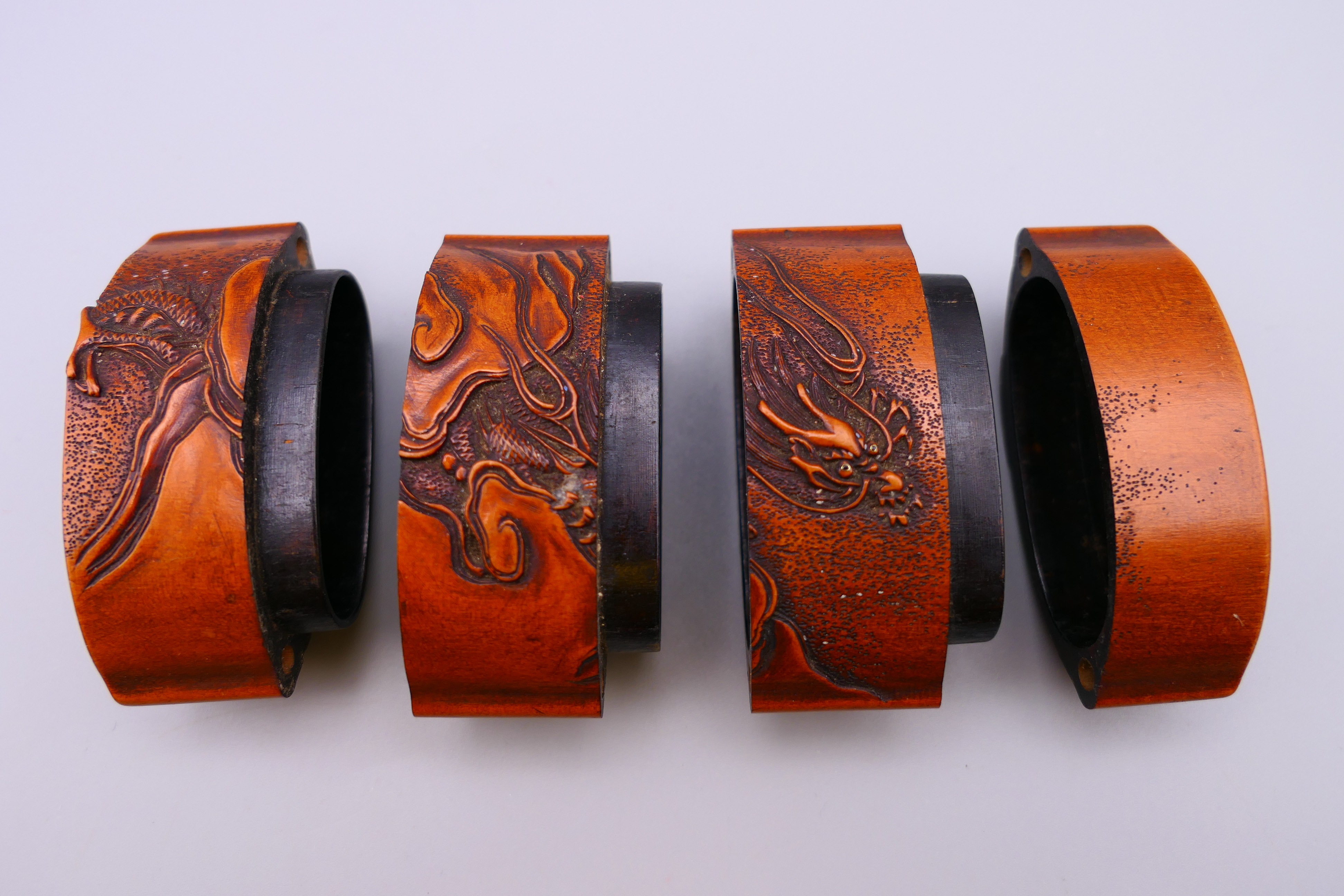 A Japanese carved wooden inro depicting mountains and a dragon amongst clouds. 7.5 cm x 5.5 cm. - Image 3 of 4