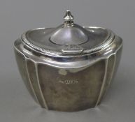 A silver tea caddy. 10 cm wide. 139.1 grammes.