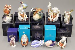 A collection of boxed Royal Crown Derby paperweights.