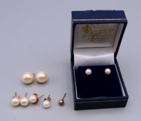 A quantity of pearl earrings.