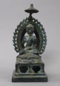 An Oriental bronze model of Buddha. 19.5 cm high.