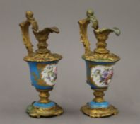 A pair of 19th century gilt metal mounted porcelain ewers. 17 cm high.