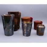 Three sets of leather cased silver plated stirrup cups, two sets engraved with initials RWWP,