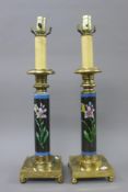A pair of black cloisonne column lamps. 55 cm high overall.