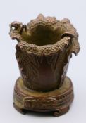 A bronze censer formed as leaves and a locust. 5 cm high.