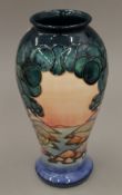A Moorcroft Mamoura vase. 31.5 cm high.