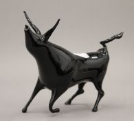 A Murano glass model of a bull. 16 cm long.