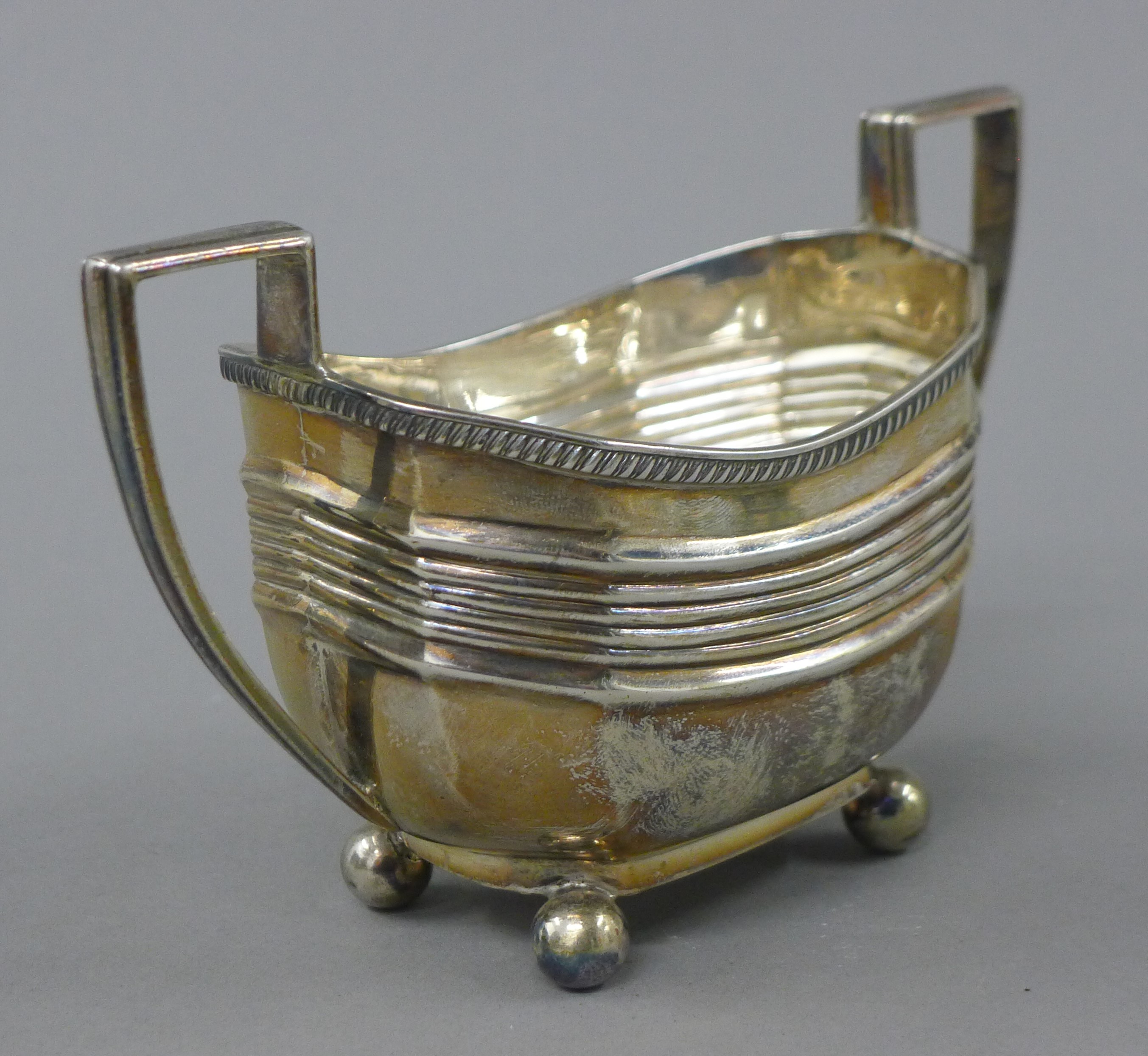 A silver three-piece tea set. The teapot 29 cm long. 854.6 grammes total weight. - Image 7 of 11