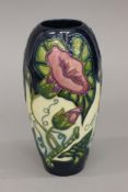 A Moorcroft Convolvulus vase. 18 cm high.