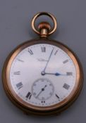 A Waltham pocket watch. 5 cm diameter.
