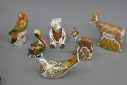 A collection of Royal Crown Derby paperweights.