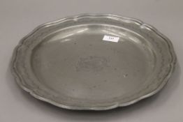 An 18th century pewter charger. 36 cm diameter.